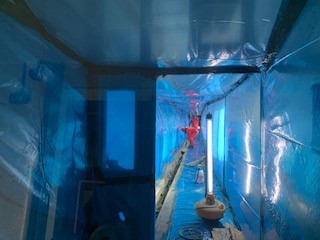 People working inside Asbestos Containment 