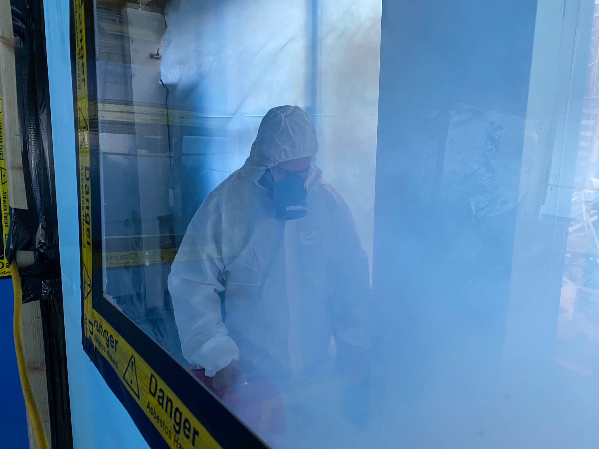 Asbestos Expert In PPE conducting smoke test